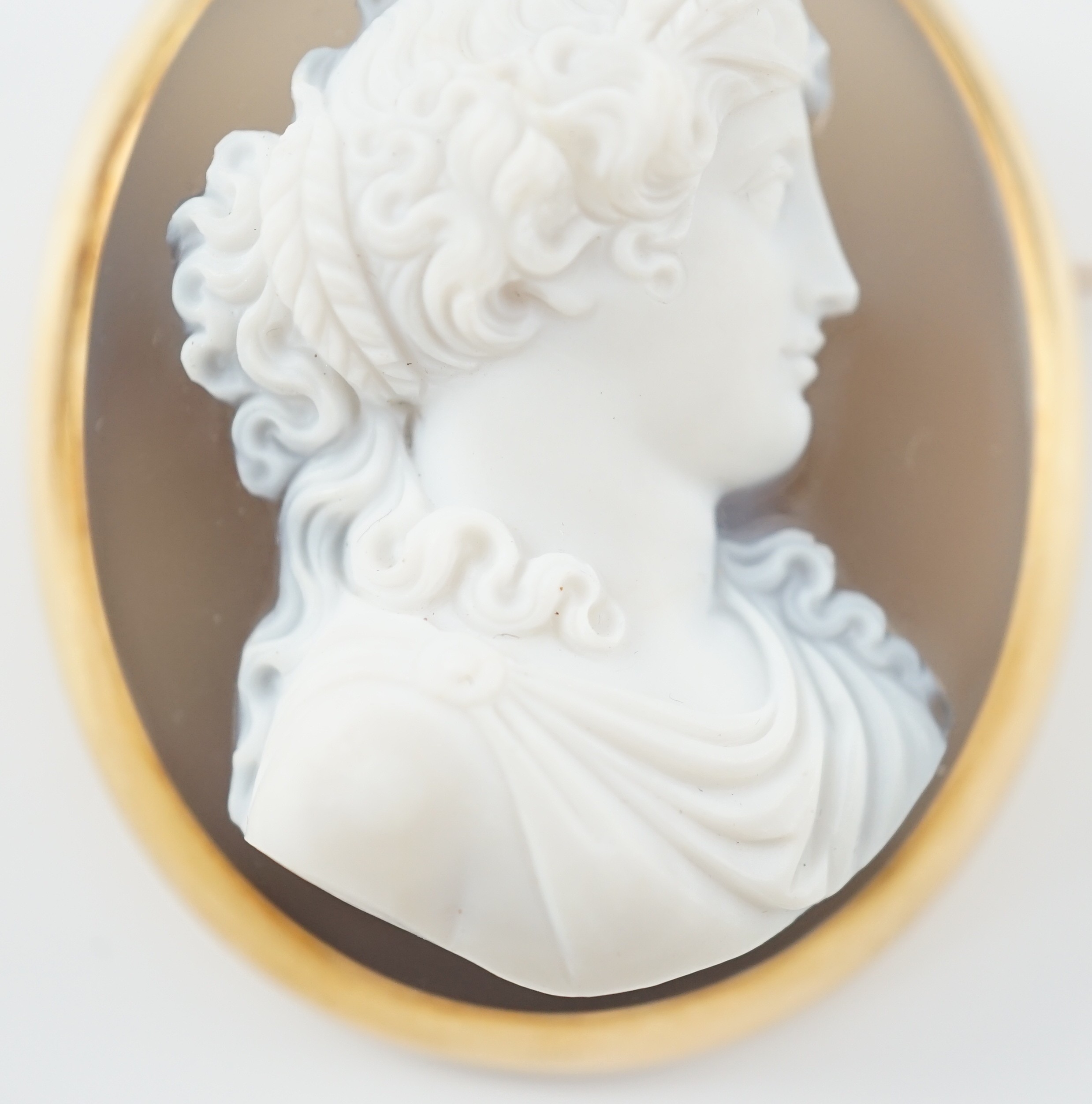 A late 19th/early 20th century gold mounted chalcedony cameo set oval brooch